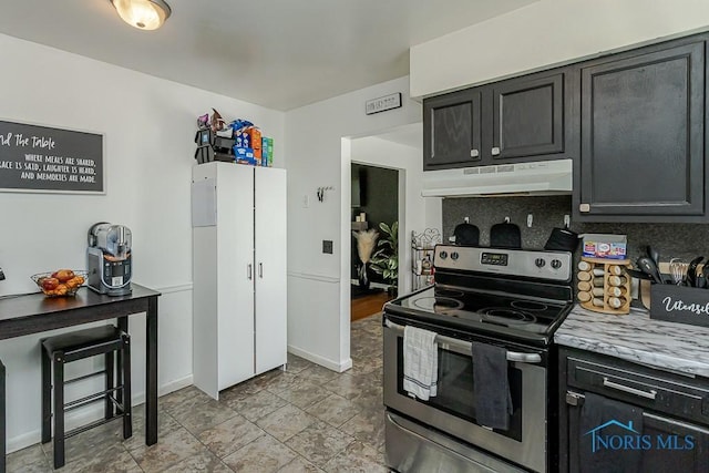 853 Circleview Dr, Toledo, OH 43615 - kitchen with baseboards, stainless steel electric range, under cabinet range hood, tasteful backsplash, and dark cabinetry