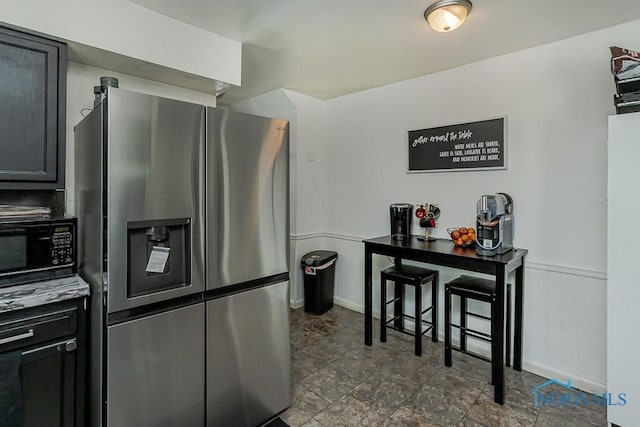 853 Circleview Dr, Toledo, OH 43615 - kitchen with black microwave and stainless steel fridge with ice dispenser