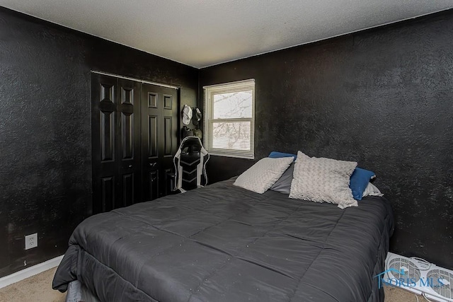 853 Circleview Dr, Toledo, OH 43615 - carpeted bedroom featuring baseboards, a textured wall, and a closet