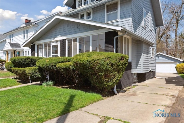 2000 Oakwood Ave, Toledo, OH 43607 - view of property exterior with an outdoor structure and a garage