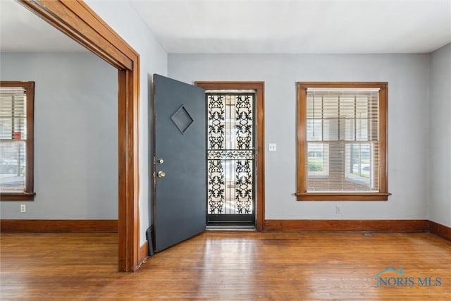 2000 Oakwood Ave, Toledo, OH 43607 - foyer entrance with wood finished floors, baseboards, and plenty of natural light