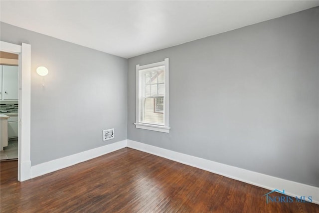 2000 Oakwood Ave, Toledo, OH 43607 - spare room with baseboards and wood finished floors