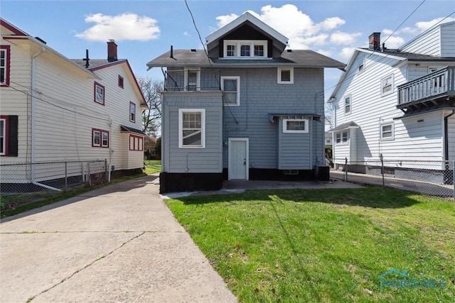 2000 Oakwood Ave, Toledo, OH 43607 - back of house featuring a lawn, a fenced backyard, and central AC unit