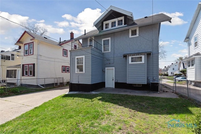 2000 Oakwood Ave, Toledo, OH 43607 - back of property with fence, a yard, and cooling unit