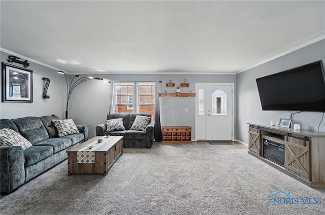 living area featuring baseboards, carpet flooring, and ornamental molding