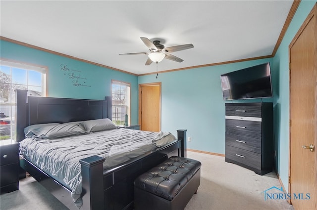 bedroom with ceiling fan, light carpet, ornamental molding, and baseboards