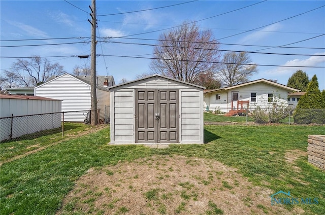 view of shed with fence