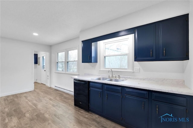 kitchen featuring a baseboard heating unit, a sink, light wood-style floors, blue cabinetry, and dishwasher