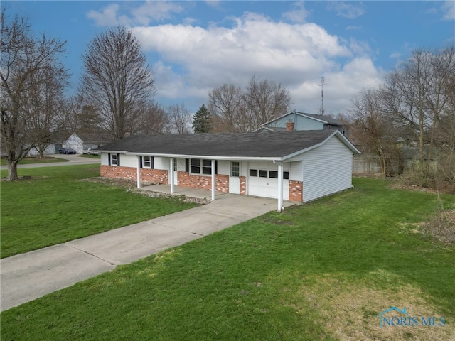 view of front facade with driveway, covered porch, an attached garage, a front yard, and brick siding