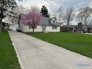713 E Crocker St, Bradner, OH 43406 - view of front facade featuring a front lawn