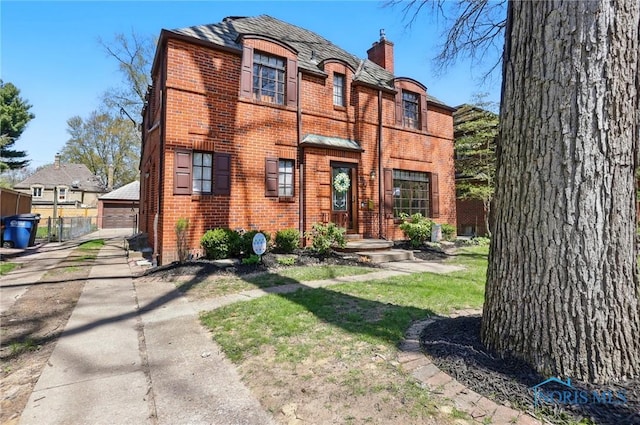 3122 Hopewell Pl, Toledo, OH 43606 - view of front of property featuring a chimney, a detached garage, and brick siding