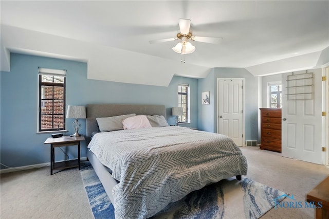 3122 Hopewell Pl, Toledo, OH 43606 - carpeted bedroom with ceiling fan, baseboards, and multiple windows