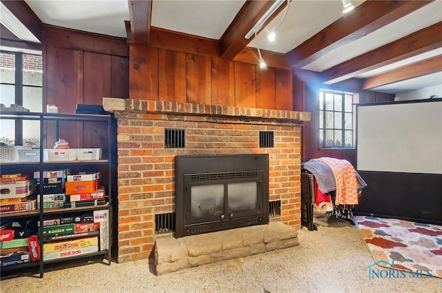 3122 Hopewell Pl, Toledo, OH 43606 - interior space featuring beam ceiling, visible vents, speckled floor, and a brick fireplace