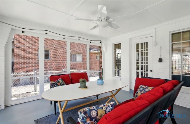 3122 Hopewell Pl, Toledo, OH 43606 - sunroom / solarium with an outdoor living space, ceiling fan, outdoor dining space, and brick wall
