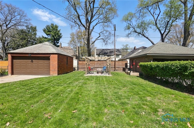 3122 Hopewell Pl, Toledo, OH 43606 - view of yard featuring a garage, fence, and an outbuilding