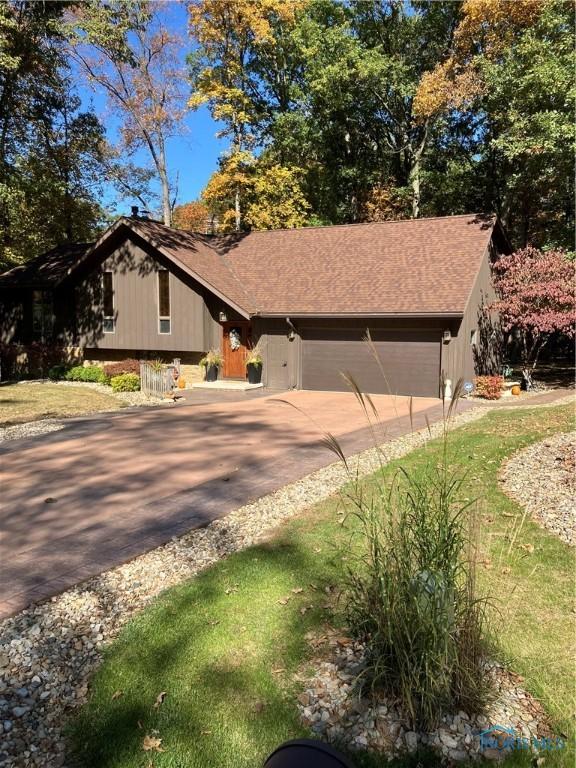 view of front facade with an attached garage and driveway