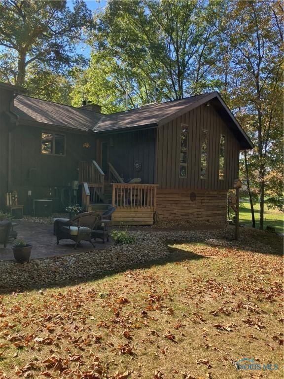 back of property featuring a patio