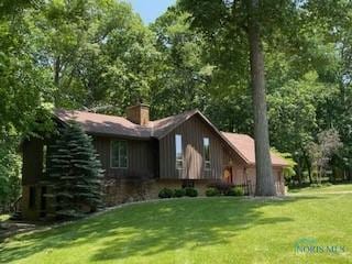 955 Greenbrier Rd, Upper Sandusky, OH 43351 - rear view of property with a yard and a chimney