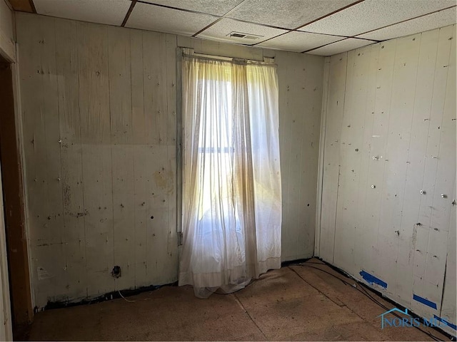 1331 Grand Ave, Toledo, OH 43606 - empty room featuring a paneled ceiling, wooden walls, and visible vents
