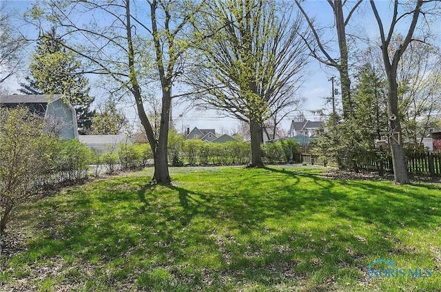 view of yard featuring fence