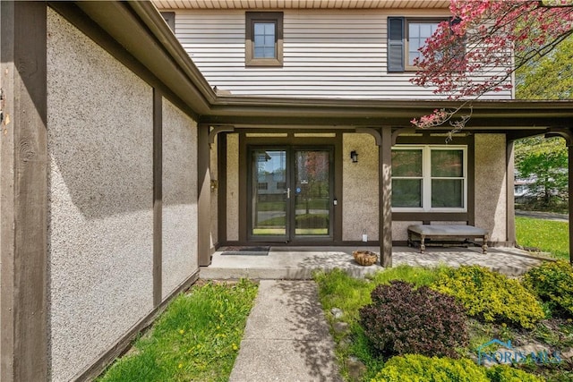 1705 Archwood Ln, Toledo, OH 43614 - doorway to property with a porch and stucco siding