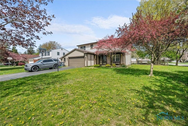 1705 Archwood Ln, Toledo, OH 43614 - view of front of home with a garage, a front lawn, and aphalt driveway