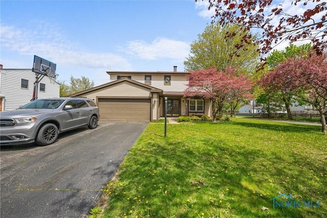 1705 Archwood Ln, Toledo, OH 43614 - traditional-style home featuring an attached garage, a front lawn, central AC, and aphalt driveway