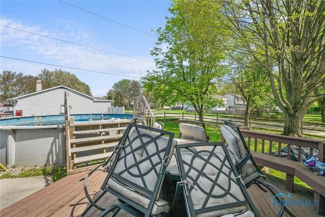 1705 Archwood Ln, Toledo, OH 43614 - wooden terrace featuring an outdoor pool and outdoor dining space