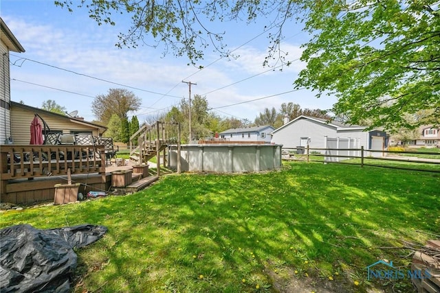 1705 Archwood Ln, Toledo, OH 43614 - view of yard with an outdoor pool, fence, and a deck