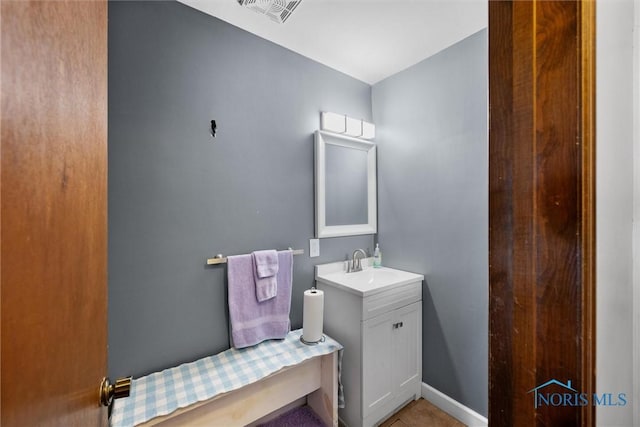 1705 Archwood Ln, Toledo, OH 43614 - bathroom featuring baseboards, visible vents, and vanity