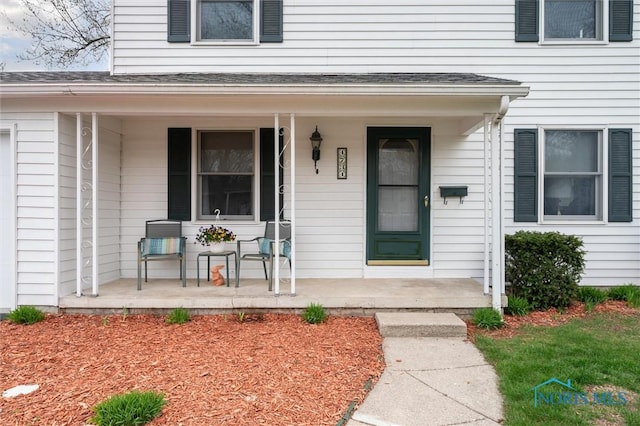 property entrance featuring a porch