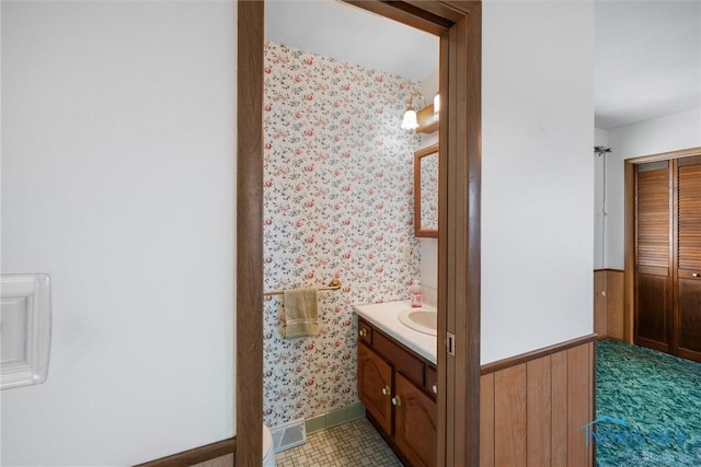 5148 Fern Dr, Toledo, OH 43613 - bathroom with visible vents, baseboards, wallpapered walls, and vanity
