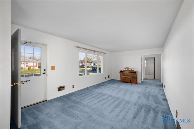 5148 Fern Dr, Toledo, OH 43613 - living area with carpet floors, baseboards, and a wealth of natural light