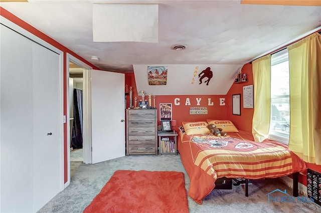 carpeted bedroom with visible vents and lofted ceiling