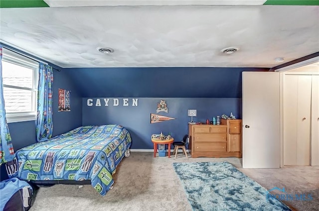 carpeted bedroom with visible vents