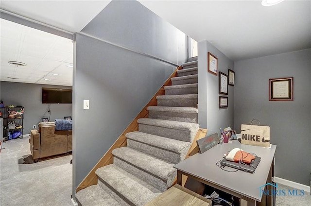 stairs with carpet and baseboards