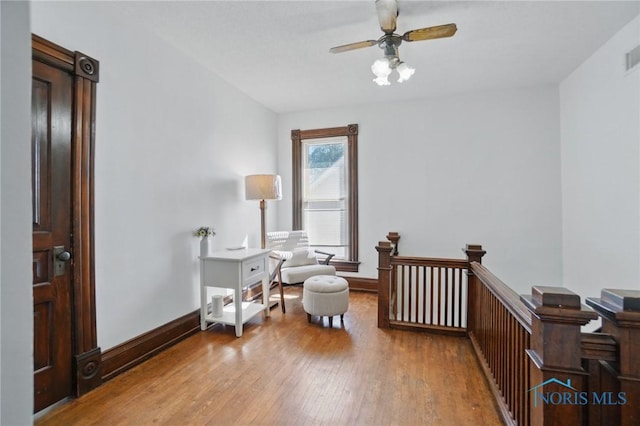 bedroom featuring visible vents, baseboards, and wood-type flooring