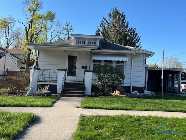 bungalow with a porch and a chimney