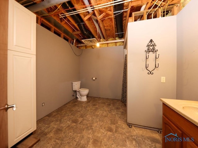 18875 County Road 12, Rawson, OH 45881 - bathroom featuring toilet and vanity