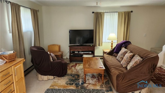 carpeted living room with a baseboard radiator