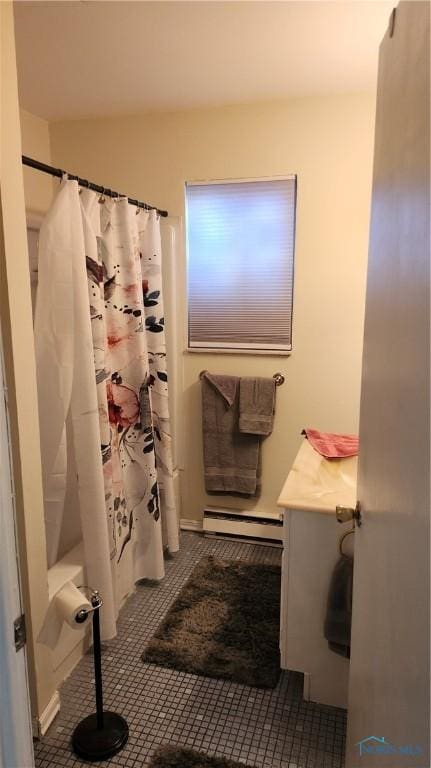 full bathroom with a baseboard radiator, tile patterned floors, and a shower with shower curtain
