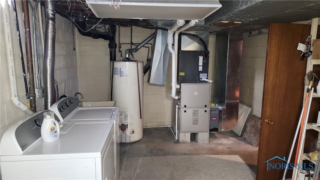 interior space featuring laundry area, heating unit, gas water heater, and independent washer and dryer