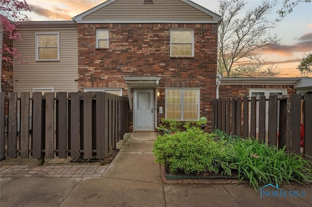 5718 Aspen Dr Unit 15, Toledo, OH 43615 - view of front of property featuring brick siding and fence private yard