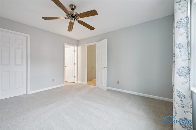 5718 Aspen Dr Unit 15, Toledo, OH 43615 - unfurnished bedroom featuring a ceiling fan, baseboards, and light colored carpet