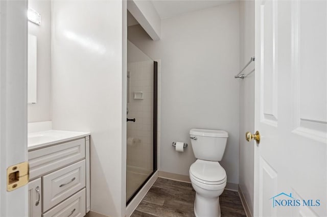 5718 Aspen Dr Unit 15, Toledo, OH 43615 - full bathroom featuring vanity, toilet, baseboards, a shower stall, and wood finished floors