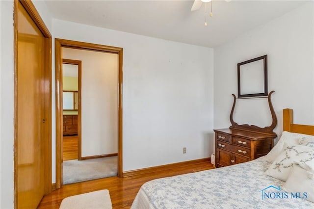 bedroom featuring light wood-style flooring and baseboards