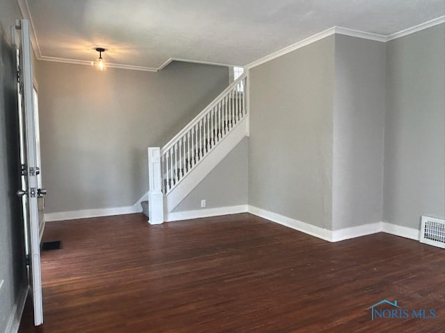 419 Spencer St, Toledo, OH 43609 - interior space with dark wood finished floors, visible vents, ornamental molding, baseboards, and stairs