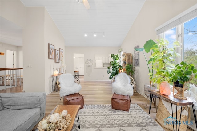 interior space featuring baseboards and light wood-type flooring