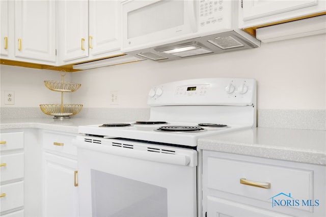 kitchen featuring light countertops, white cabinets, and white appliances