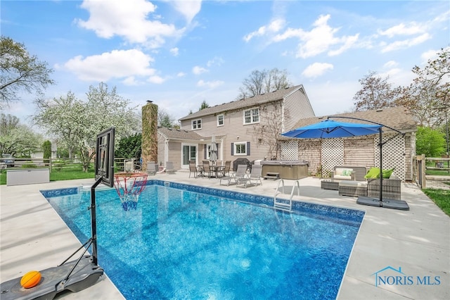 view of swimming pool with a patio, a fenced in pool, outdoor lounge area, a hot tub, and fence